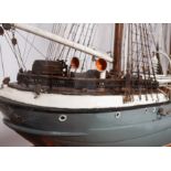 A cased scale model of the sailing ship 'Cicely': standing and running rigged over planked deck