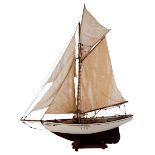 Scale model of a gaff rigged sloop: set full sails over pine deck with fixtures and fittings,