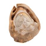 A late 19th century cameo carved conch shell: with a portrait of Liberty, 12cm long.
