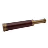 A late 19th/ early 20th century mahogany and brass two draw telescope: inscribed 'Abrahams Option,