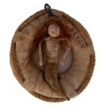 An early 20th century SS Devon souvenir in the form of a mermaid seated in a life preserver: