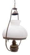 A brass ship's hanging oil lamp: the inverted baluster frame with white glass shade over copper