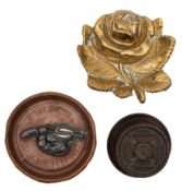 A small brass tompion-style paper weight with HMS 'Carlise' crest, on wooden base, 8cm diameter ,