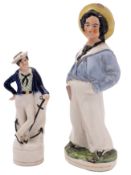 A 19th century Staffordshire figure of a second or third class boy: dressed in straw hat,