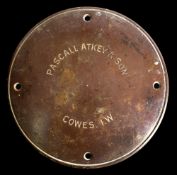 A circular brass building nameplate for 'Pascall Atkey & Son, Cowes IW':, 22.2cm diameter.