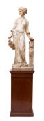 An Italian sculpted alabaster model of a maiden, circa 1900; portrayed standing and loosely draped,