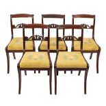 A set of five Regency mahogany side chairs,