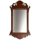 A walnut fret framed wall mirror in George I style,