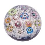 A dated Perthshire spaced millefiori paperweight set with a figural cat and a dog cane and other