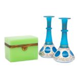 An opaline glass table casket and a pair of overlay glass bottles,