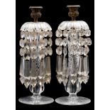 A pair of 19th century cut-glass lustre candlesticks with gilt-metal sconces,