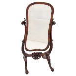 A Victorian mahogany and stained beech swing frame cheval mirror of cartouche shape with inset