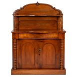 A Victorian mahogany chiffonier, arched back with turned supports,