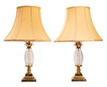 A pair of cut glass and gilt metal mounted table lamps,