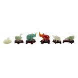 A group of six small Chinese carved hardstone animals and an Egyptian patinated metal bowl the