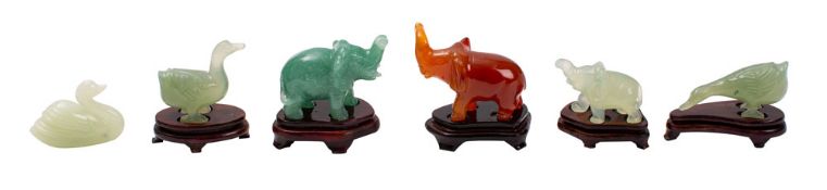A group of six small Chinese carved hardstone animals and an Egyptian patinated metal bowl the