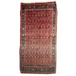 A Bidjar Kelleh, the brick red field with an all over geometric stellar design,