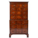 A walnut veneer chest on chest of small size in the 18th Century style,