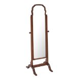 A Georgian style walnut mirror on a cheval frame, 136cm high x 36cm wide.