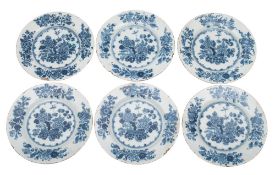 A set of six Irish blue and white delftware plates painted in the 'Chinese Flower-bowl' pattern,