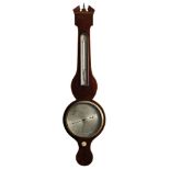 A mahogany wheel barometer the eight-inch round silvered dial engraved with usual barometer