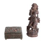 A Chinese lacquer cased enamel box and an Indian hardwood carving of a deity the box carved with a