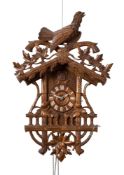A Victorian Black Forest cuckoo wall clock the eight-day duration movement striking on a gong,