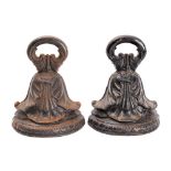 A pair of George IV or William IV cast iron door porters,