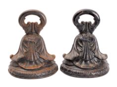 A pair of George IV or William IV cast iron door porters,