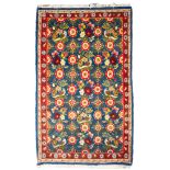 A Veramin rug, the blue field with a characteristic Mina Khani design of birds,