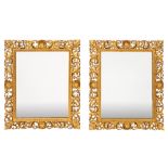 A pair of 19th Century carved giltwood Florentine wall mirrors of rectangular shape,
