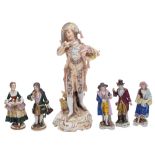 A group of Continental porcelain figures, comprising a Sitzendorf dandy on a gilt scrolling base,