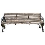 A pair of painted wrought iron and wood garden benches,