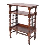 An oak library bookstand in Arts and Crafts style, designed by Leonard Wyburd for Liberty & Co.