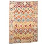 An Anatolian kelim, the stepped lozenge field with geometric designs in pastel shades,