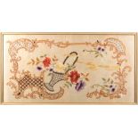 A Japanese silk embroidered panel of a basket of flowers within an elaborate scrollwork border,