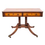 A Regency mahogany and inlaid library table, bordered with boxwood and ebony lines,