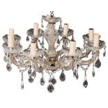 A moulded glass and metal mounted eight light chandelier,