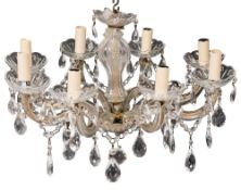 A moulded glass and metal mounted eight light chandelier,