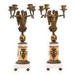 A pair of gilt bronze and white marble mounted four light figural candelabra in Empire style,