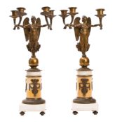 A pair of gilt bronze and white marble mounted four light figural candelabra in Empire style,