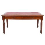 An Edwardian oak rectangular library table, the top with a moulded edge,