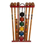 A children's part painted and turned wood croquet set, mid 20th century; the six mallets,