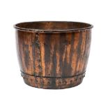 A Victorian copper basin, now utilised as a log bin,