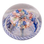 A Baccarat close pack millefiori mushroom paperweight the centre with brightly coloured star,
