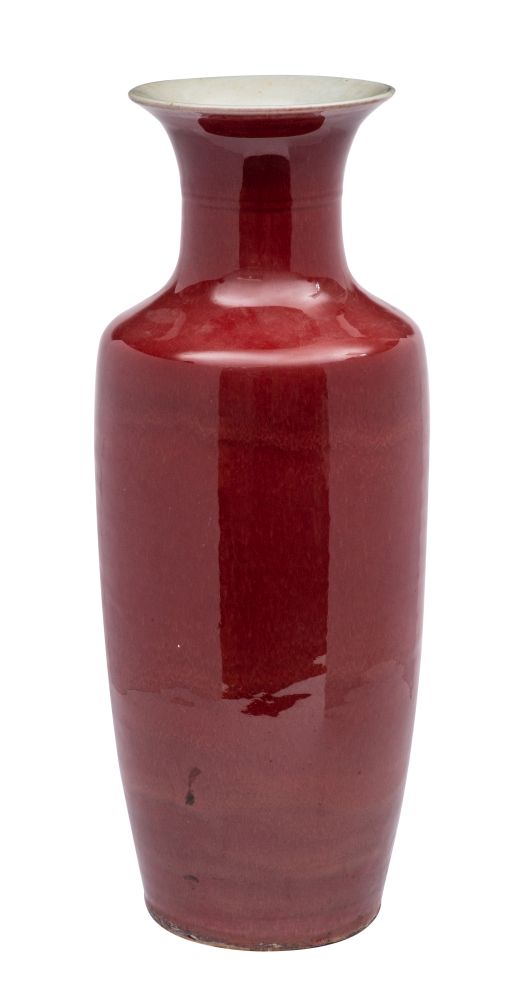 A large Chinese copper-red baluster vase the glaze falling short at the flared rim,