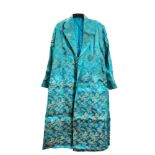 Two Chinese silk embroidered dresses worked overall with designs of flower sprays on green and