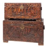 Two Chinese relief carved camphorwood trunks,