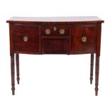 A Regency mahogany and inlaid bow-fronted sideboard of small size, bordered with ebony lines,