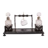 An Anglo Indian ebony and ivory inlaid decanter stand,